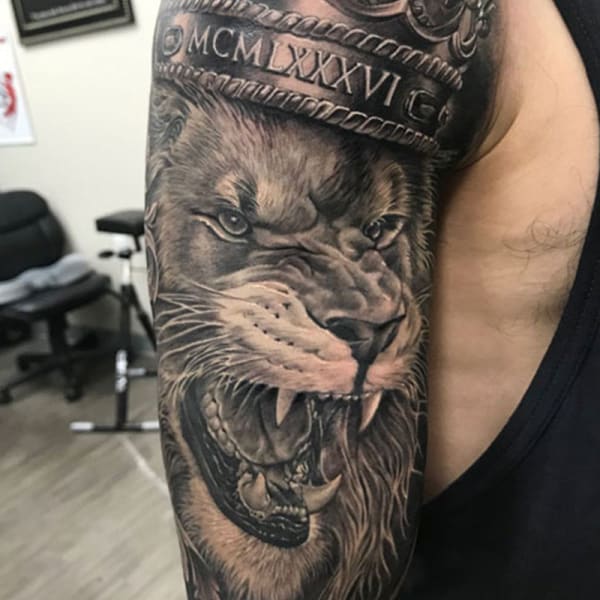 roaring lion with crown tattoo